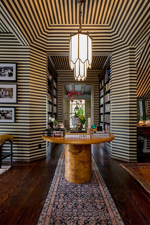 An unexpected counterpart to the vintage furnishings, the stripes on the walls were painted by hand. This foyer is shown on the cover of Pierce & Ward’s new (and first) book, A Tale of Interiors. Find traditional runners like the one above here.
